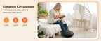 A woman sits on a black foot massager in a bright bedroom while reading a book. The left side includes marketing text reading 'Enhance Circulation' with three orange heat icons and temperatures 113°F, 122°F, and 131°F.