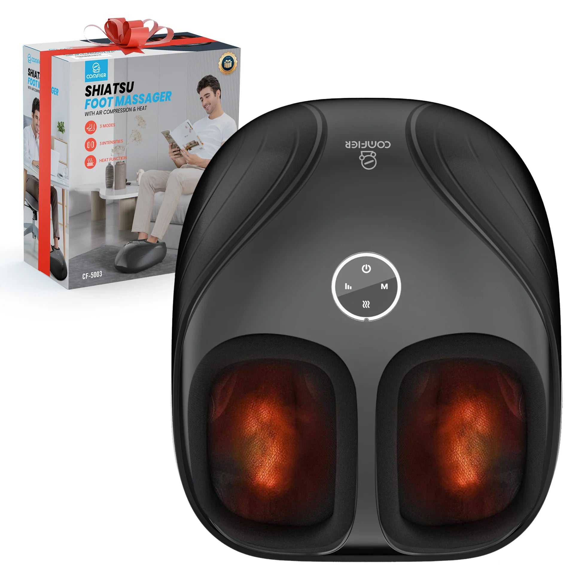 A black foot massager shown in front of its retail box. The massager has two illuminated foot compartments with a warm orange glow and a central control panel.