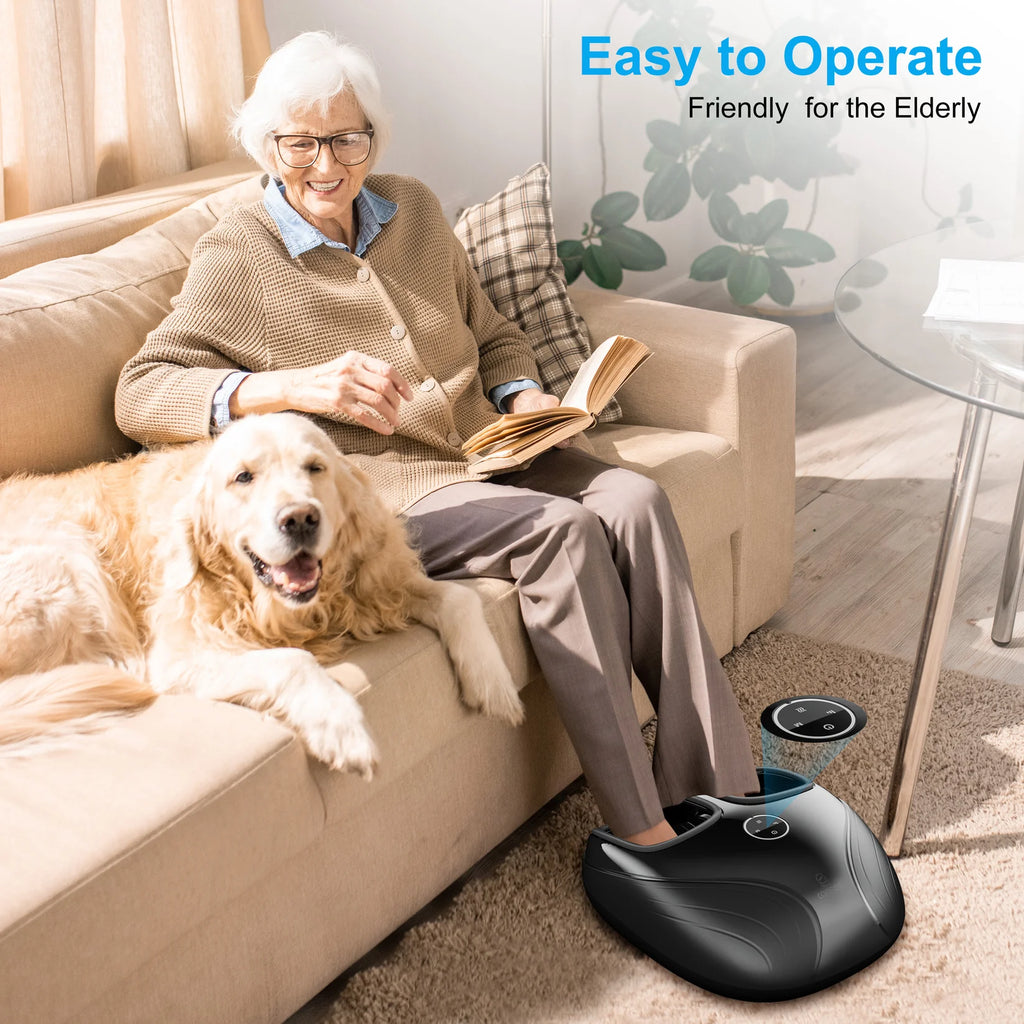 A black foot massager being used by an elderly woman sitting on a beige sofa with a golden retriever dog. The text 'Easy to Operate Friendly for the Elderly' is visible in the top right corner.