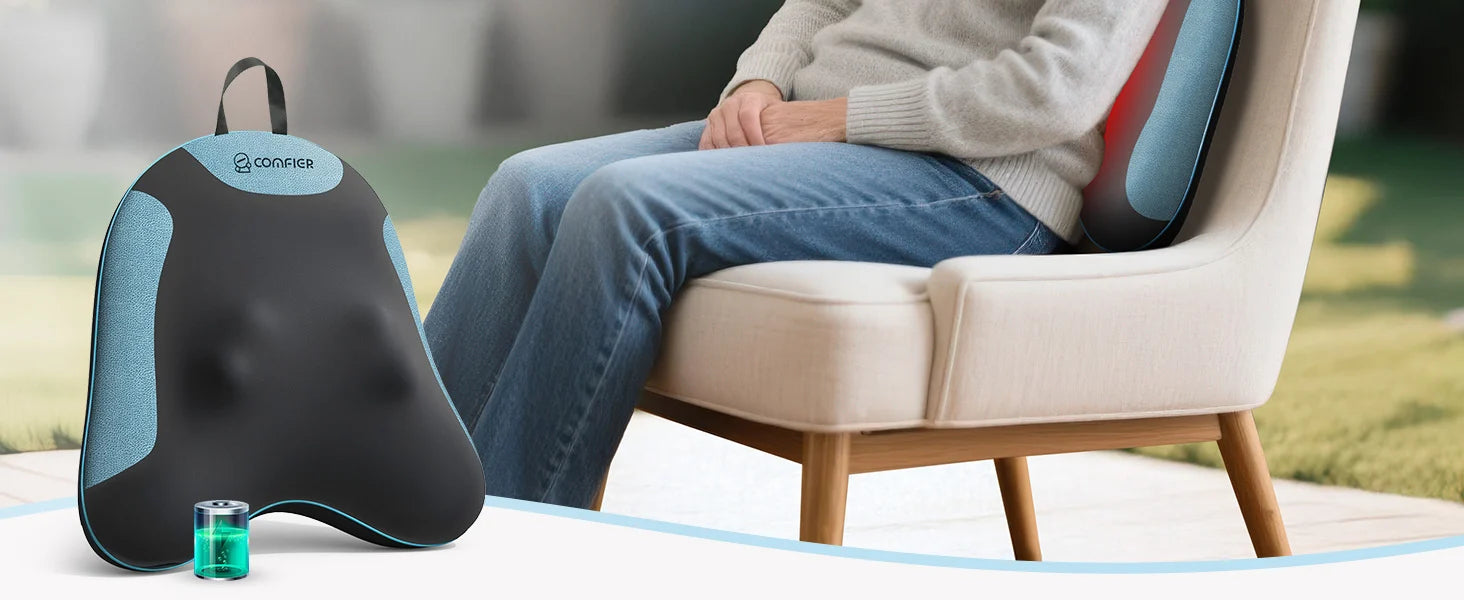 A lumbar support pillow shown next to a person sitting in a chair, with a small charging case in front. The pillow is black and light blue with the 'omnia' brand logo visible.