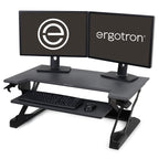 Ergotron standing desk with two monitors on a white background