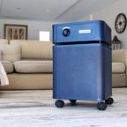 Blue air purifier on a wooden floor with a living room background