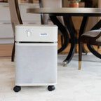 Air purifier with 'austin' branding on a light-colored floor.