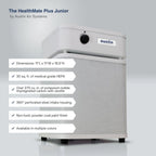 Austin Air Systems HealthMate Plus Junior air purifier shown on a light gray background with feature callout text overlays detailing dimensions, HEPA rating, carbon/zeolite capacity, intake housing, finish, and color availability.