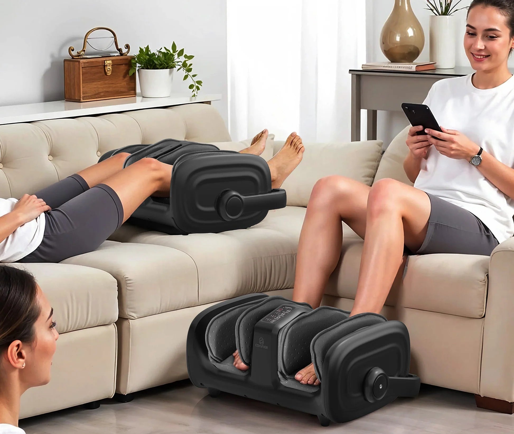 People using foot, calf, and arm massagers in a living room setting.
