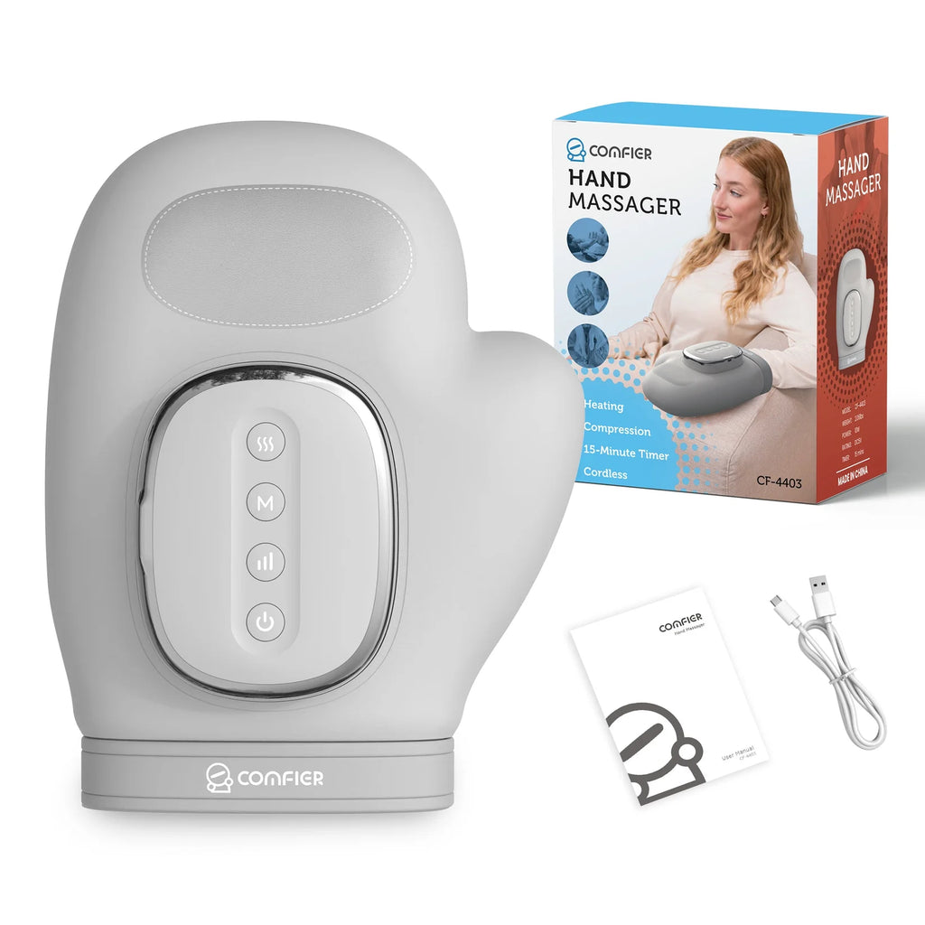 Hand massager with packaging, user manual, and cable on a white background
