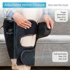 Person wearing a black leg wrap with adjustable velcro closure, showing measurements on a gray couch.