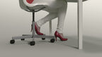 Ergotron WorkFit-TL height adjustable standing desk workstation with black frame and grey desktop surface